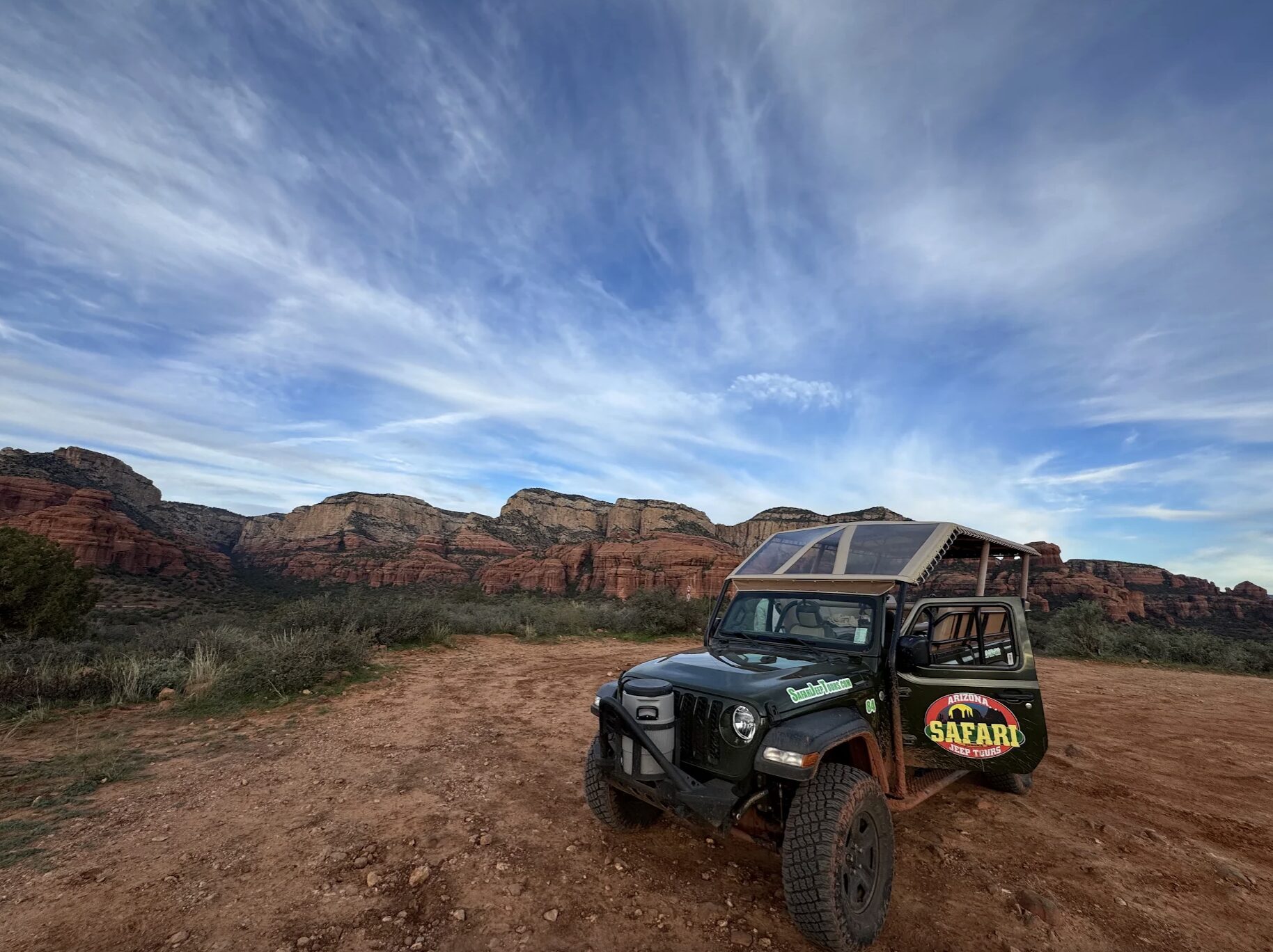 A Safari Jeep tour jeep on a trail in Sedona