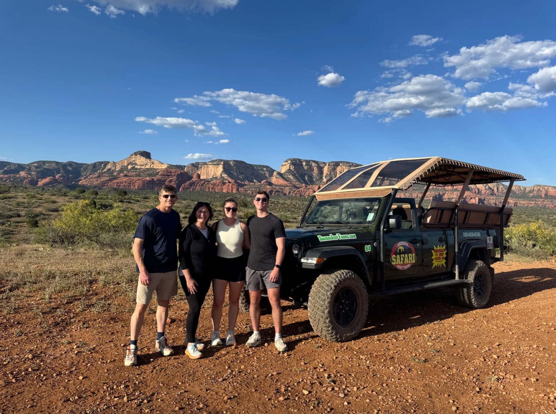 Family posing with Safari Jeep