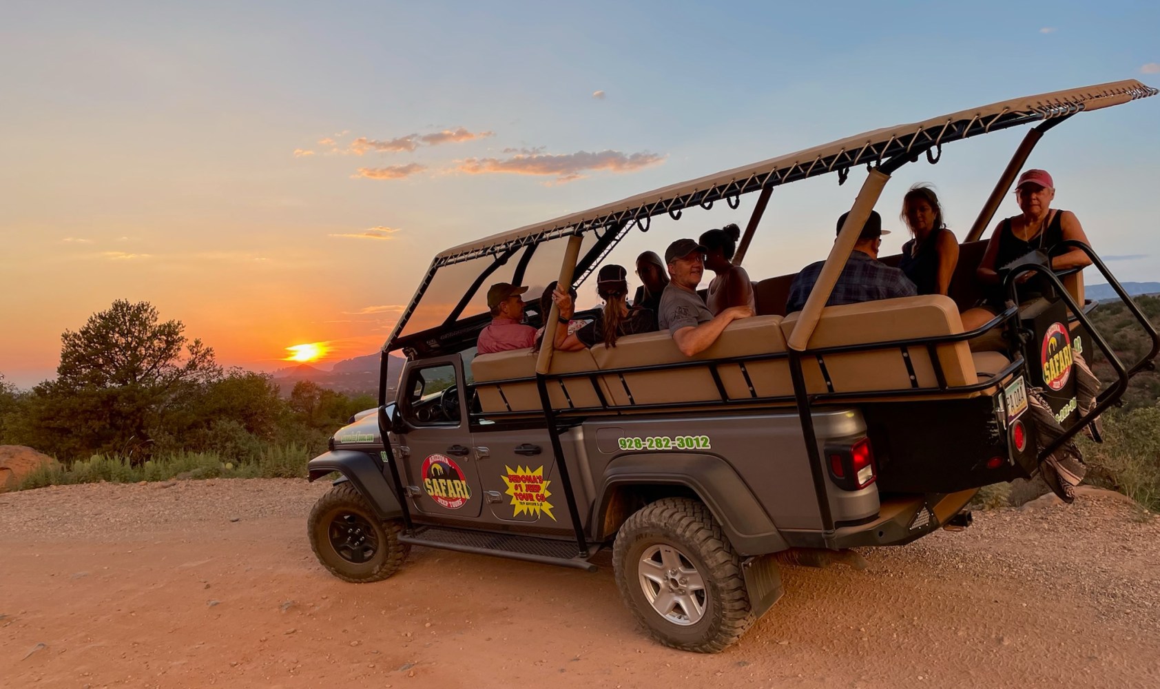 a group of people riding on the back of a truck