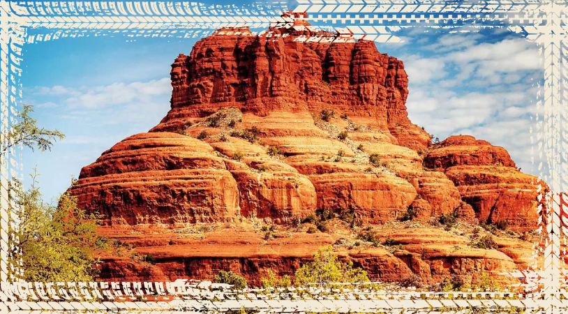 a close up of a canyon with Bell Rock in the background