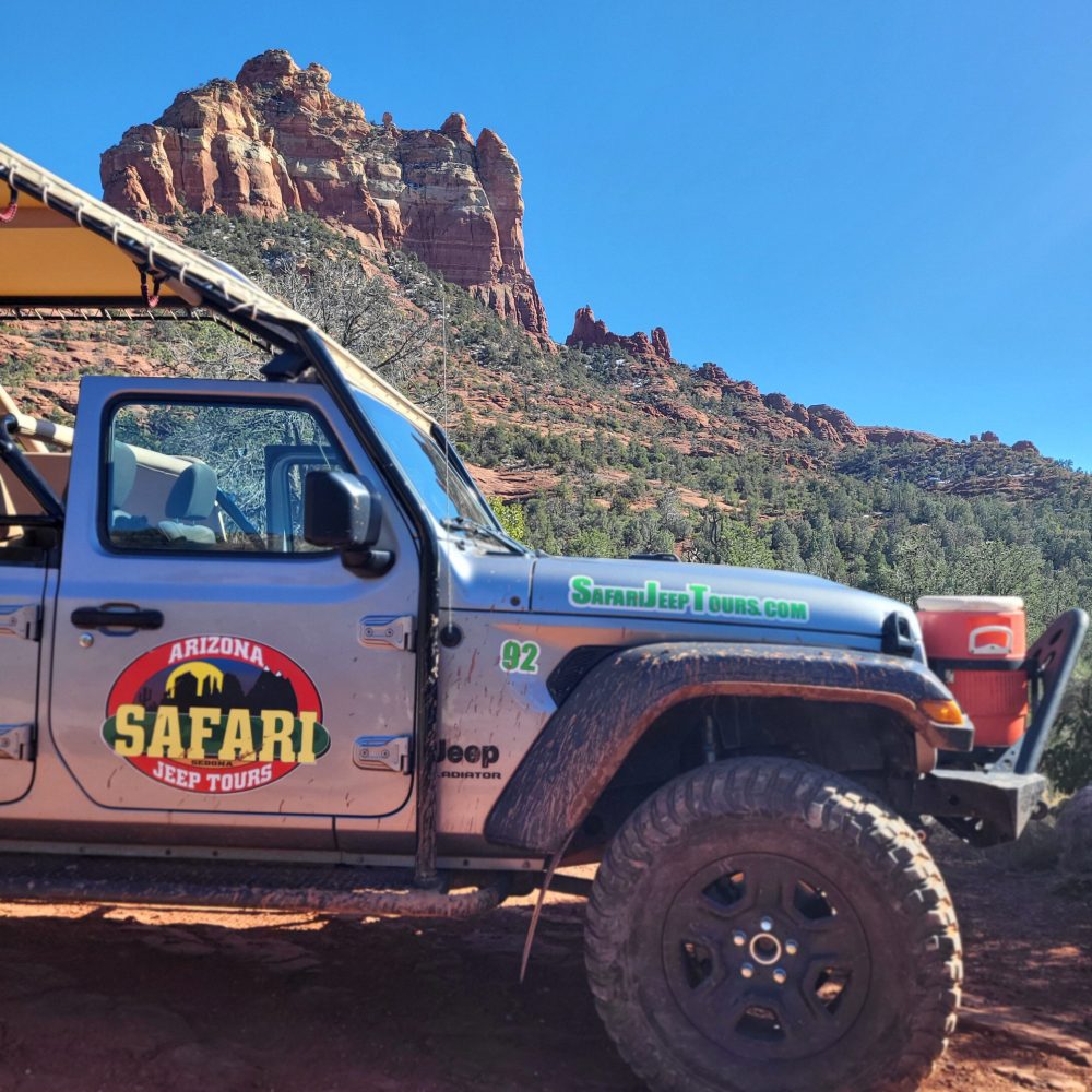 a truck is parked in front of a mountain
